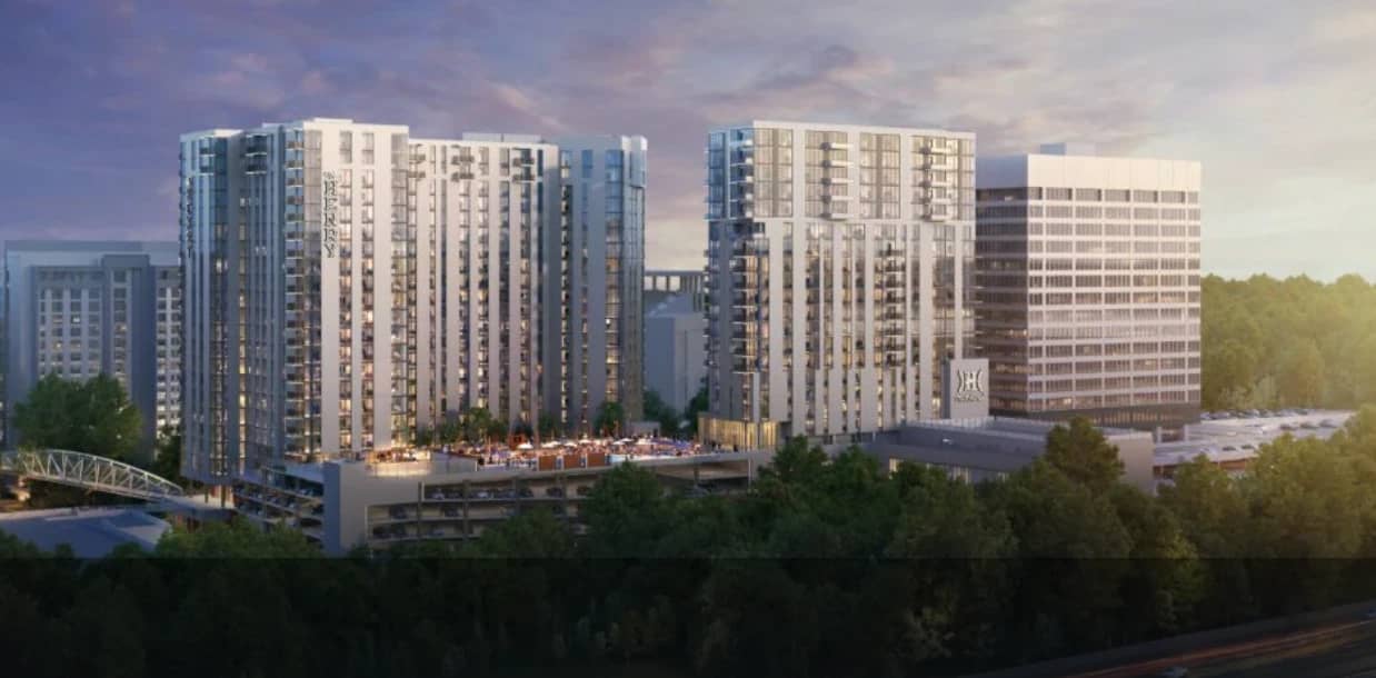 Wide architectural rendering of The Henry development showing both towers from a distance.
